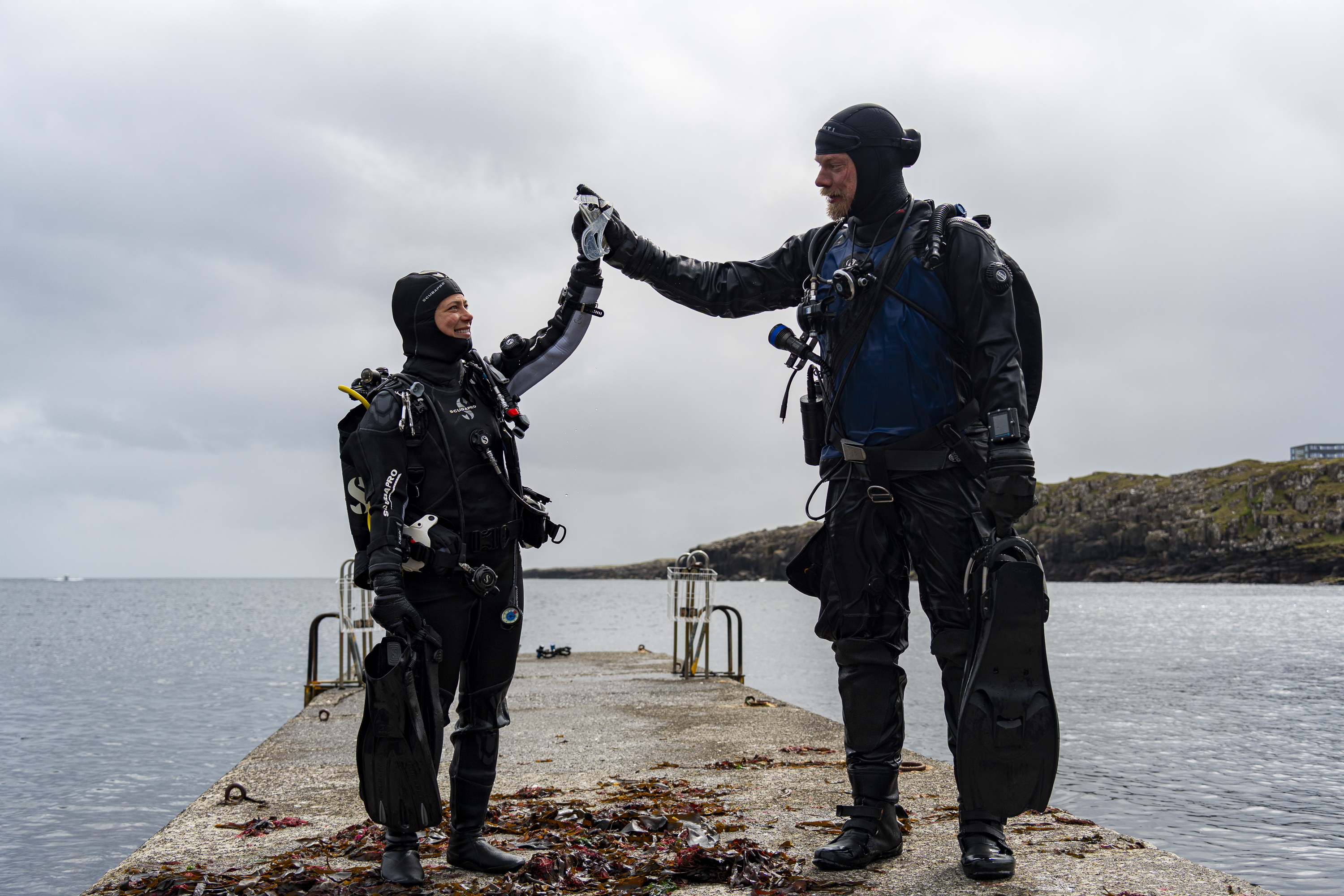 Dive buddies celebrating successful dive