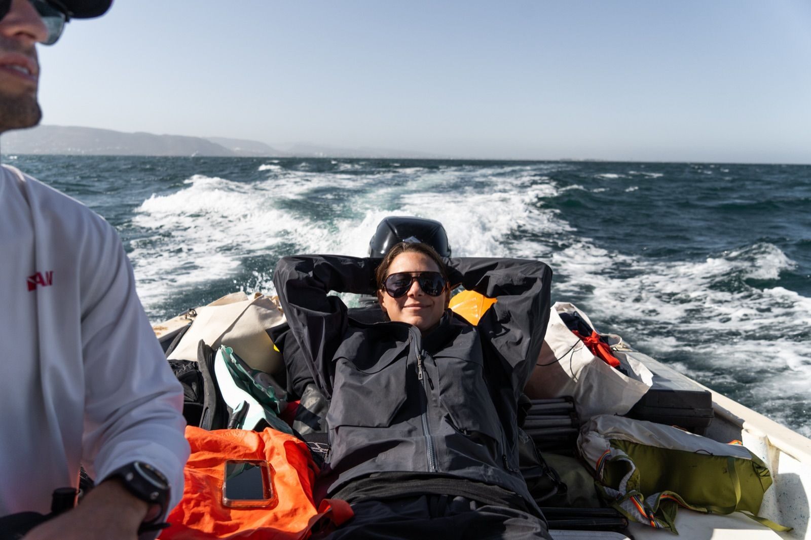 Andi Cross aboard a speedboat during an expedition