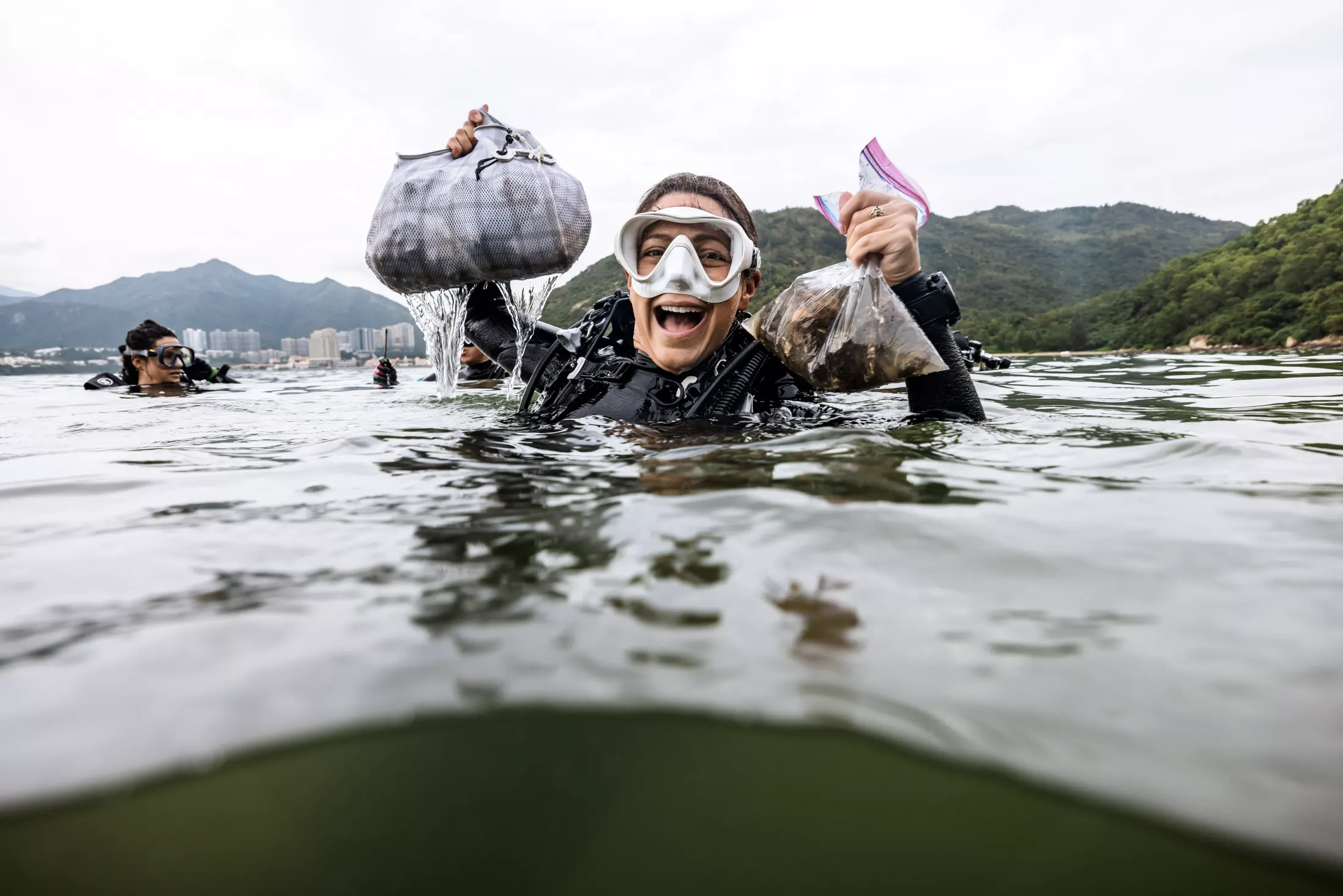 Andi Cross celebrating ocean cleanup - conservation in action