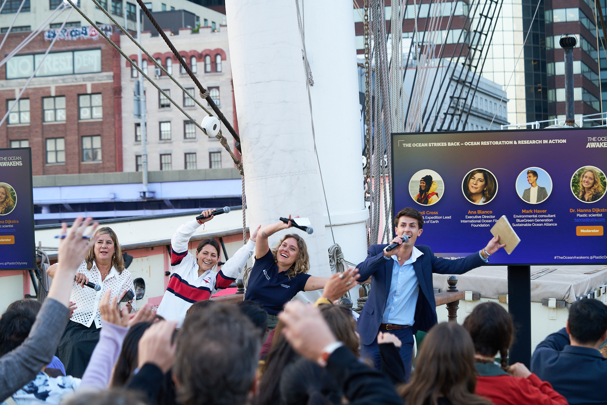 Andi Cross moderating ocean conservation panel on Plastic Odyssey ship in New York